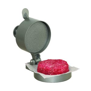 Metal burger press shaping raw ground beef patty