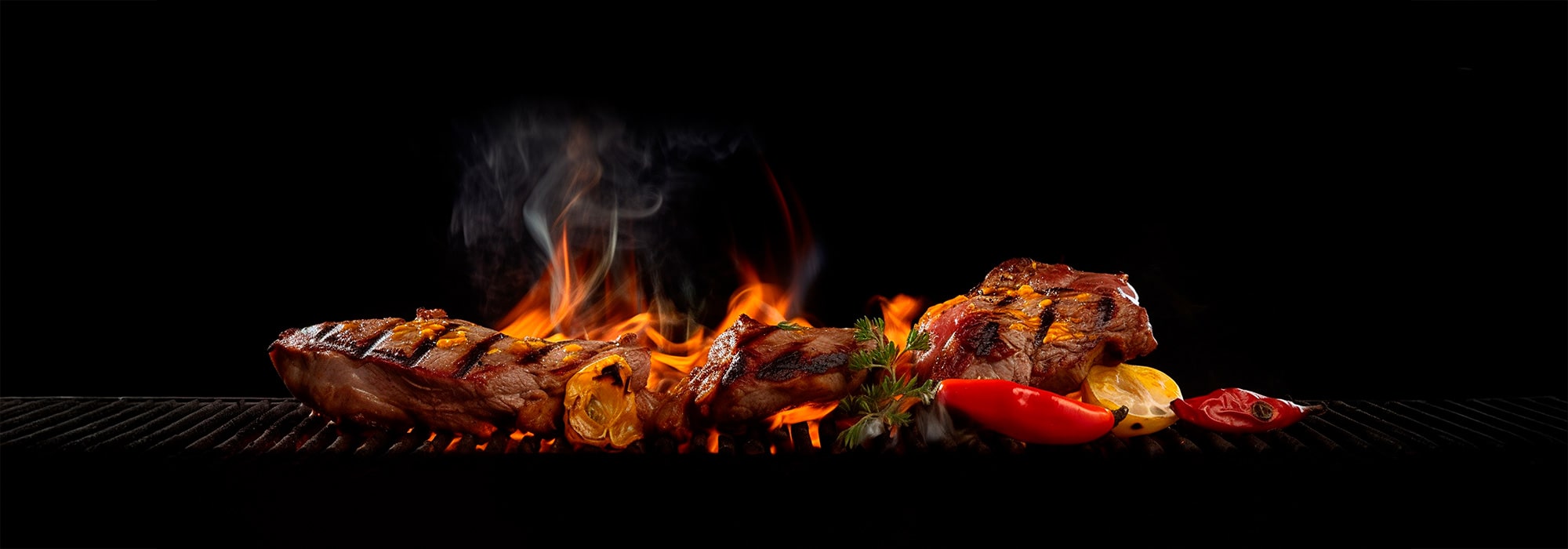 Grilled meat on fire with vegetables