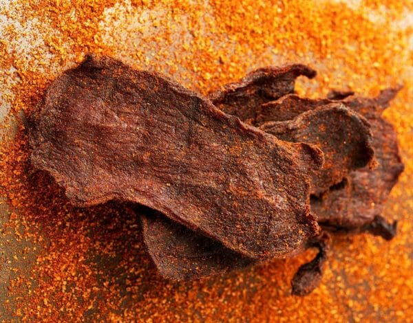 Spicy homemade beef jerky coated with dry seasoning blend